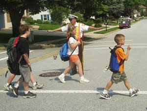 children crossing the pedestrian crossing. teaching children